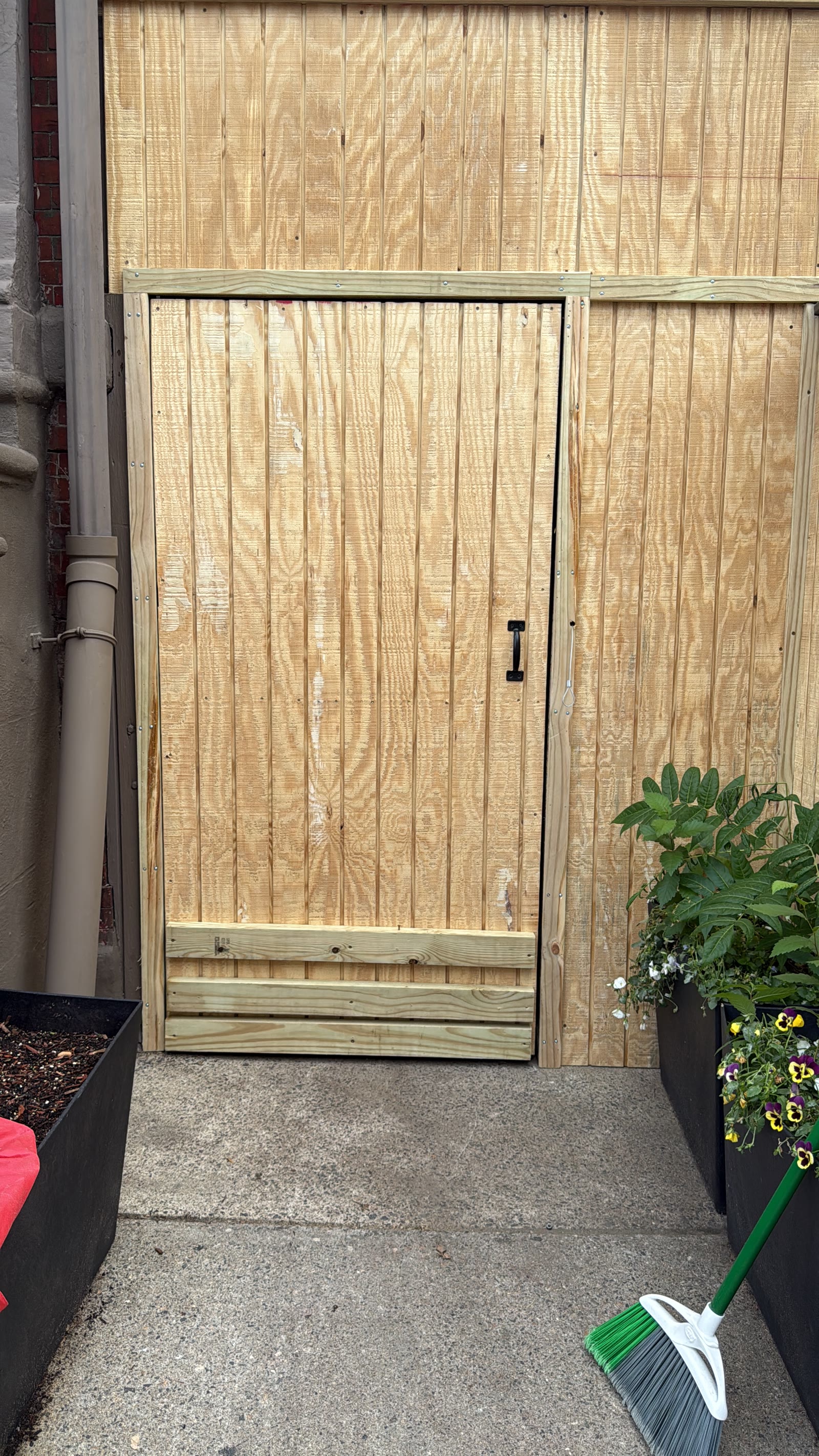 Custom-built exterior wood gate and wall
