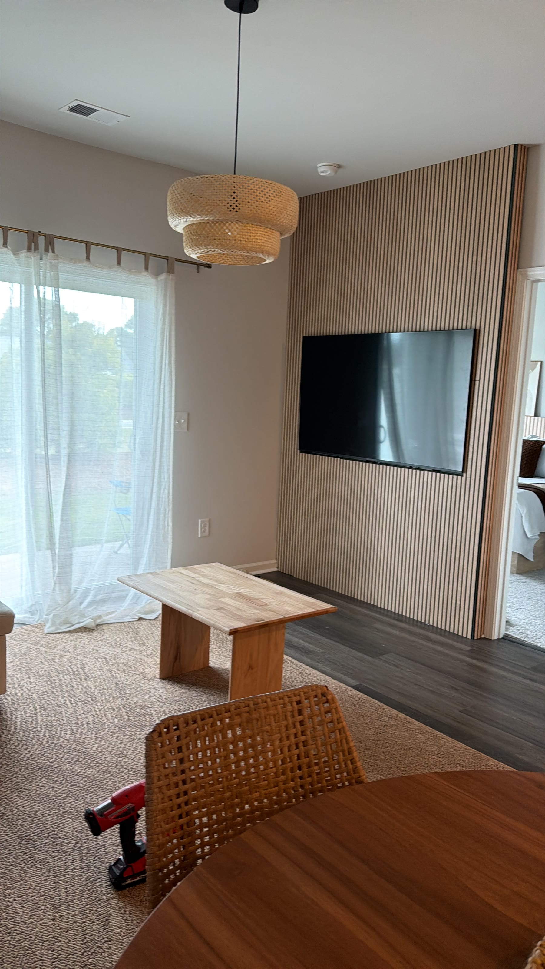 Finished wood slat media wall with mounted television